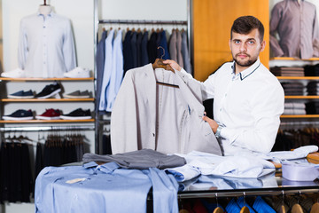 Young salesman  demonstration classic jacket