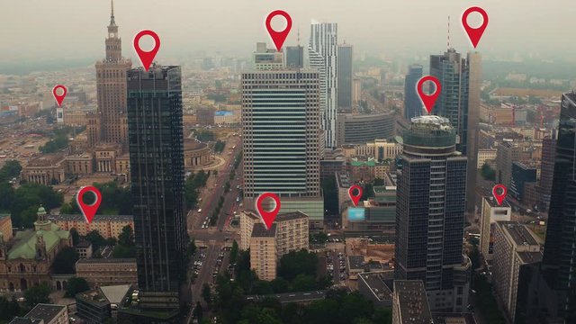 Aerial shot of Warsaw city center with localization icons.