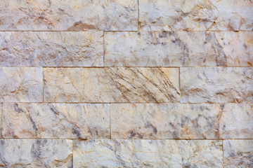 Closeup texture of marble tiles on the facade of the wall