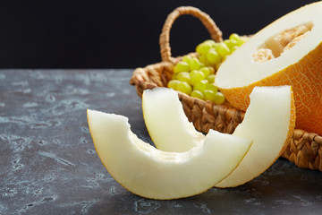 Beautiful still life with a melon on a dark background. Favorite fruit in summer. Food,Fruits or healthcare concept.
