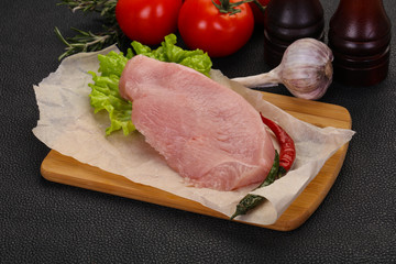 Raw Turkey steak served rosemary