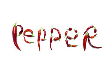 inscription pepper laid out by peppers on a white background