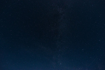 Fototapeta premium Starry sky with clouds summer night