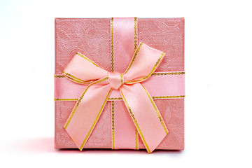 pink gift box with bow on white background, isolate, close-up
