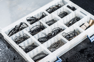 Professional fishing tackle lying in a drawer with departments for small things.