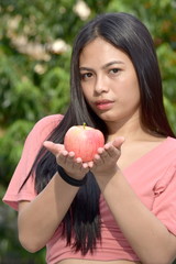 An Unemotional Adult Female With Apples