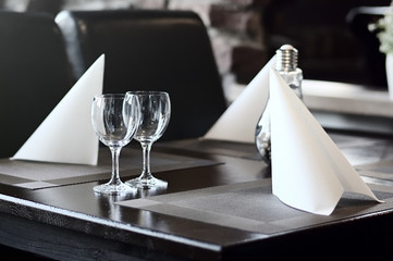 Glasses and cutlery on the table in a restaurant