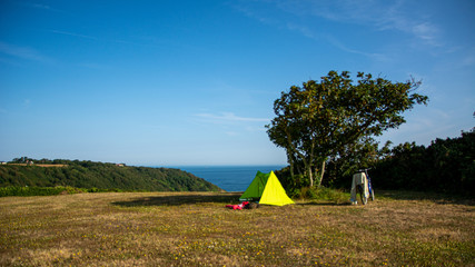 tent at sark campsite above the sea