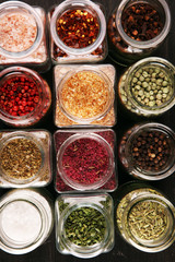 assortment of spices in glass on table. Food and cuisine ingredients and peppers