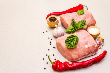 Raw pork meat loin with fresh vegetables and dry spice