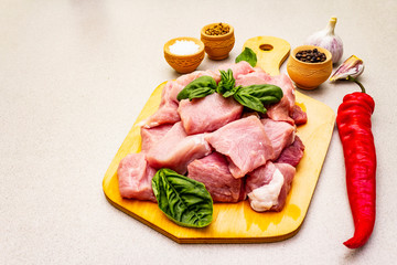 Raw pork neck, cut into pieces with fresh vegetables and dry spice