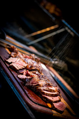 BBQ Medium Rare ancho Steak . ancho steak on salt board.  Ancho steak on the board
