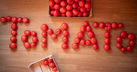 Word TOMATO made of raw fresh organic tomatoes
