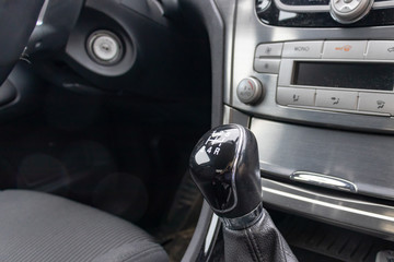 Manual gearbox transmission handle in the car close up