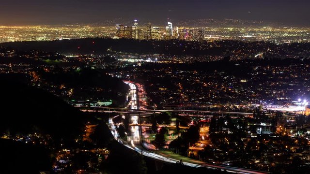 Night time lapse view of the Glendale 2 freeway and Downtown Los Angeles