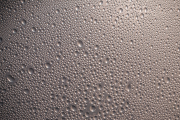 Gray metallic convex surface with bubbles. Brown texture of a shiny glass. Modern style of design. Abstract metal background.