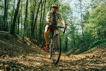 Naklejka premium Men is riding on bicycle.