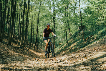 Fototapeta premium Women is riding on bicycle.