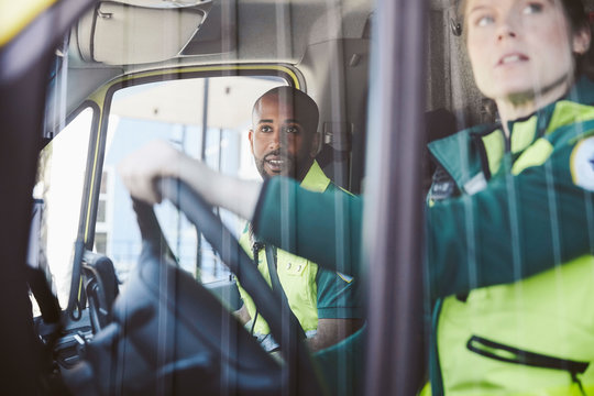 Paramedics sitting in ambulance
