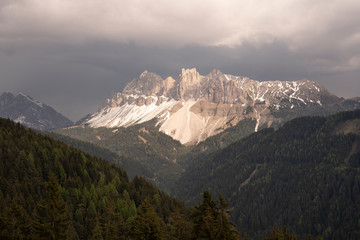 Aerial Landscape of the Dolomites, Sunset on a cloudy Day giving the Aferer Geisler Mountain a nice color.