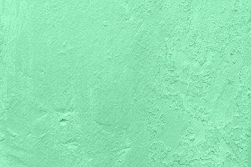 Light green concrete background rough texture