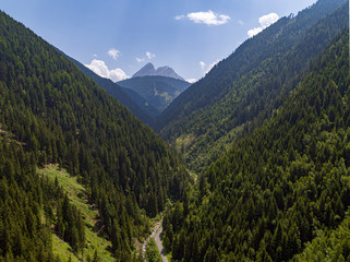 Fototapeta na wymiar Aerial view of a Valley with a Mountain in the Background. Landscape in South Tirol in the Italian Alps