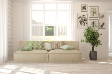 Fototapeta premium Stylish room in white color with sofa. Scandinavian interior design. 3D illustration