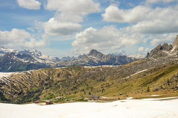 Landscape on Passo Giau in Spring, beautiful scenic view of the Dolomites in the Alps. Snow and a Sunny Day in the Dolomites
