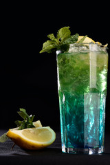 ALCOHOLIC DRINK WITH FRUIT COCKTEL on black background