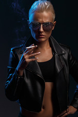 Young attractive girl holds a tied moon on a rope. Art photo.