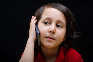 Little boy hold smartphone as modern mobile communication  concept