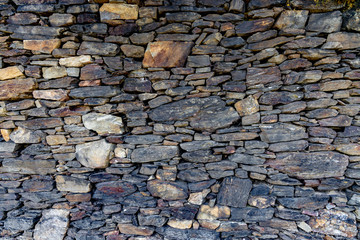 .Beautiful wall made of wild stone. Natural background.
