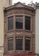Window with tinted glass of unusual architectural form