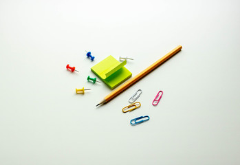 Back to school, colored pencils in composition on white background.