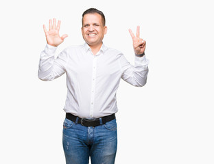 Naklejka premium Middle age arab elegant man over isolated background showing and pointing up with fingers number seven while smiling confident and happy.