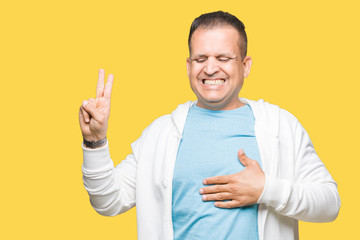 Middle age arab man wearing sweatshirt over isolated background Swearing with hand on chest and...