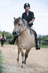 Foto op Canvas riding girl and horse © cynoclub