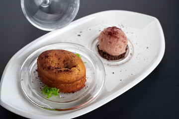 Caramel fondant on a white dish with an ice-cream
