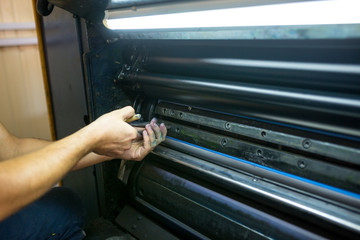 The master have service an industrial offset printing press machine. The process of tuning the...