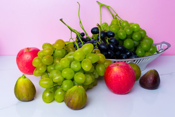 Grapes with apple on the table