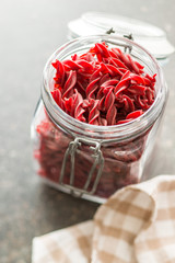 Uncooked colorful pasta with beetroot flavor