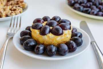The legendary Tiffany layered salad with grapes, chicken and cheese on the white background.