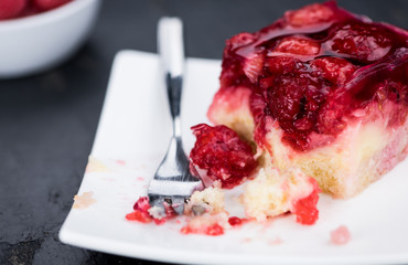 Raspberry Cake on a rustic slate slab (close-up shot)