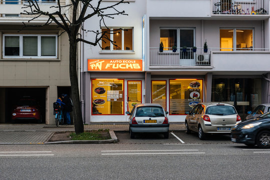 STRASBOURG, FRANCE- JAN 31, 2018: Auto Ecole Fuchs driving school at dusk in Strasbourg with illuminated facade