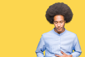Fototapeta na wymiar Young african american man with afro hair with hand on stomach because nausea, painful disease feeling unwell. Ache concept.