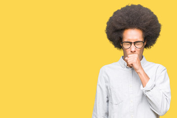Fototapeta na wymiar Young african american man with afro hair wearing glasses feeling unwell and coughing as symptom for cold or bronchitis. Healthcare concept.
