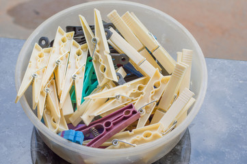 basket with clothespins, used to put clothes on clothesline, home care housewife concept