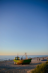 Naklejka premium fisherman boats at sunrise time on the beach