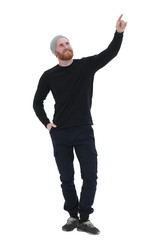 in full growth. smiling bearded man pointing at copy space