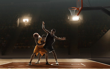 Basketball players fight for a ball near the rim